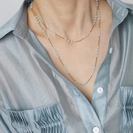 model wearing Waterproof Light Blue Bead Necklace in 18K Gold Plated Stainless steel