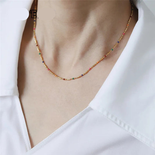 model wearing  Brighten up your style with the 18K Gold Rainbow Boho Necklace