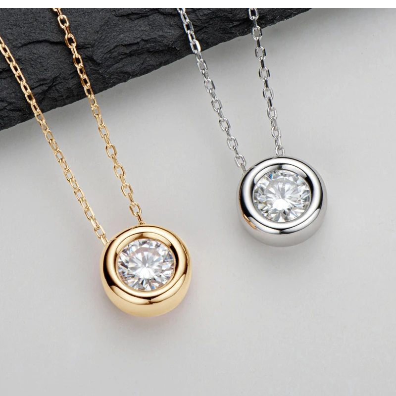 two Bezel Solitaire Moissanite necklaces side by side one in 18K Yellow Gold Plated Silver  and one in white gold plated silver