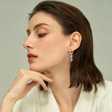 Model Wear Moissanite Drop Earrings in Gold Plated Silver_White White Gold