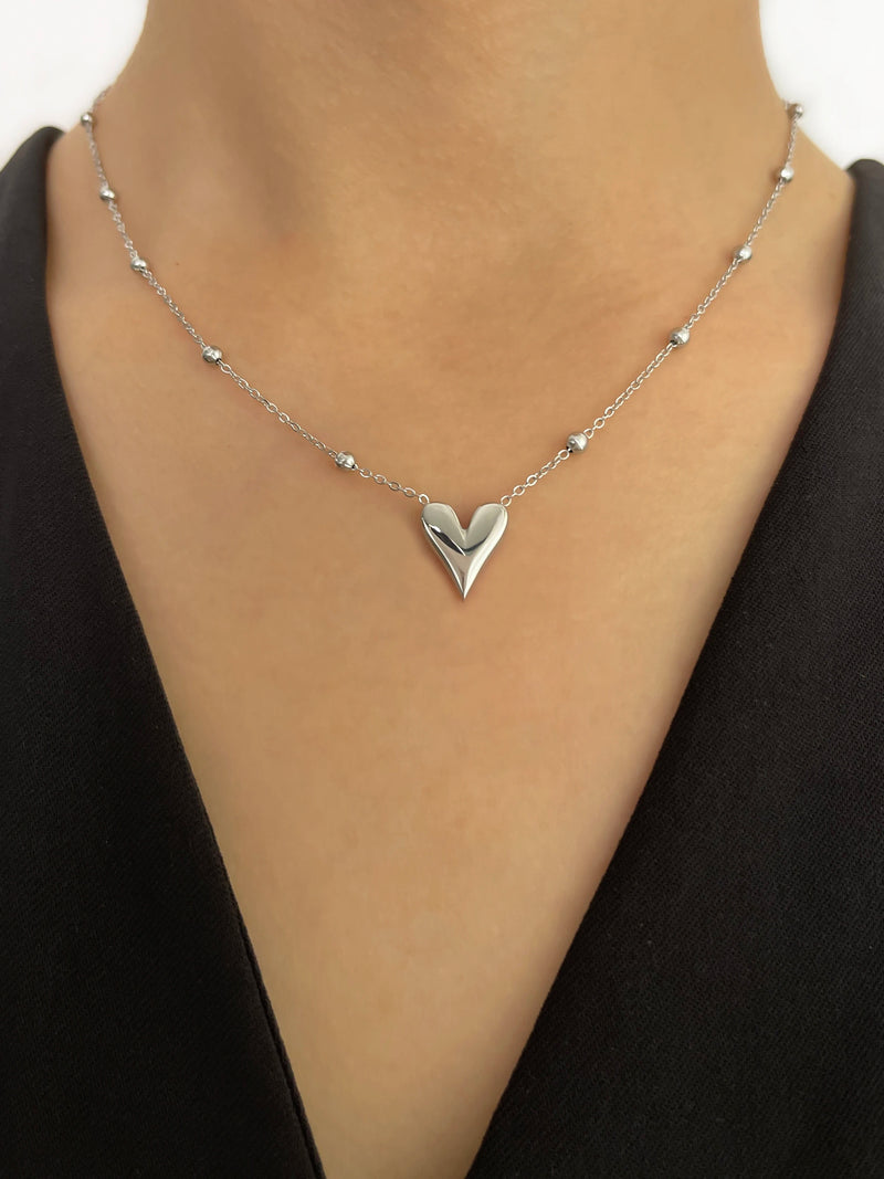 Model wearing Dainty Love Heart Bead Chain Necklace in 18K white Gold-Plated Stainless Steel