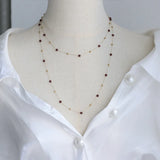 Model wearing Gold Bead & Garnet Necklace Gold-Plated Stainless Steel