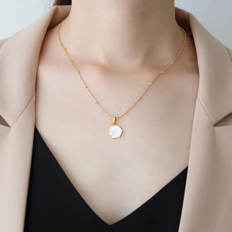 model wearing Waterproof White Shell Geometric Pendant Necklace in 18k Gold-Plated Stainless Steel - hexagon 