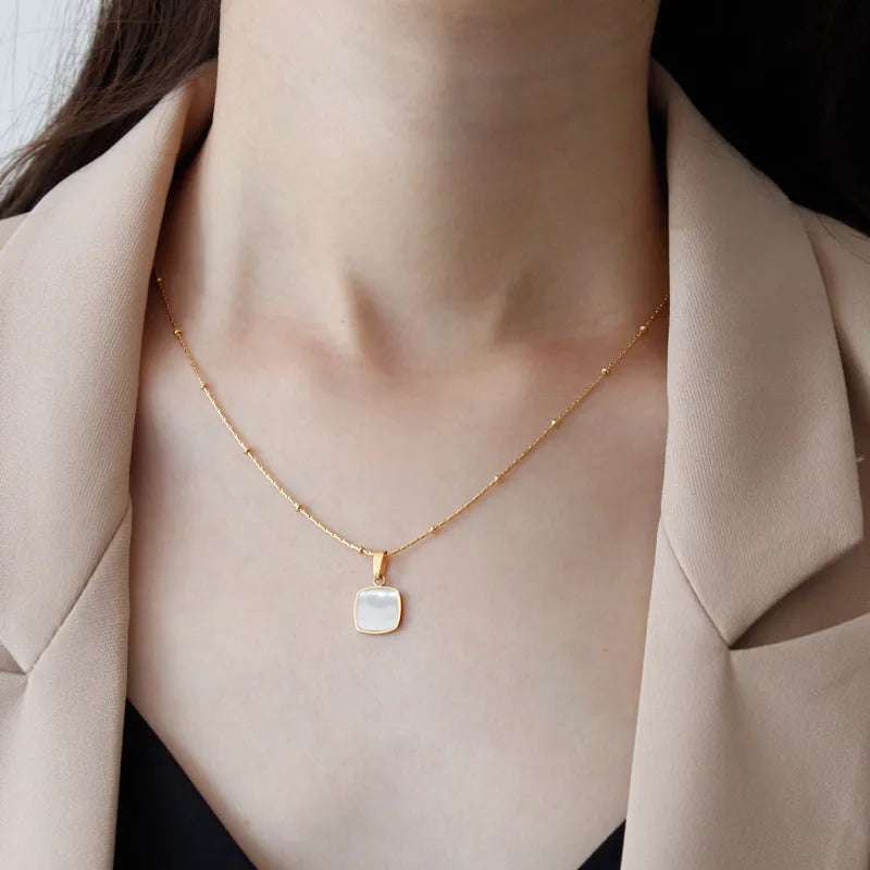 model wearing Waterproof White Shell Geometric Pendant Necklace in 18k Gold-Plated Stainless Steel - square 