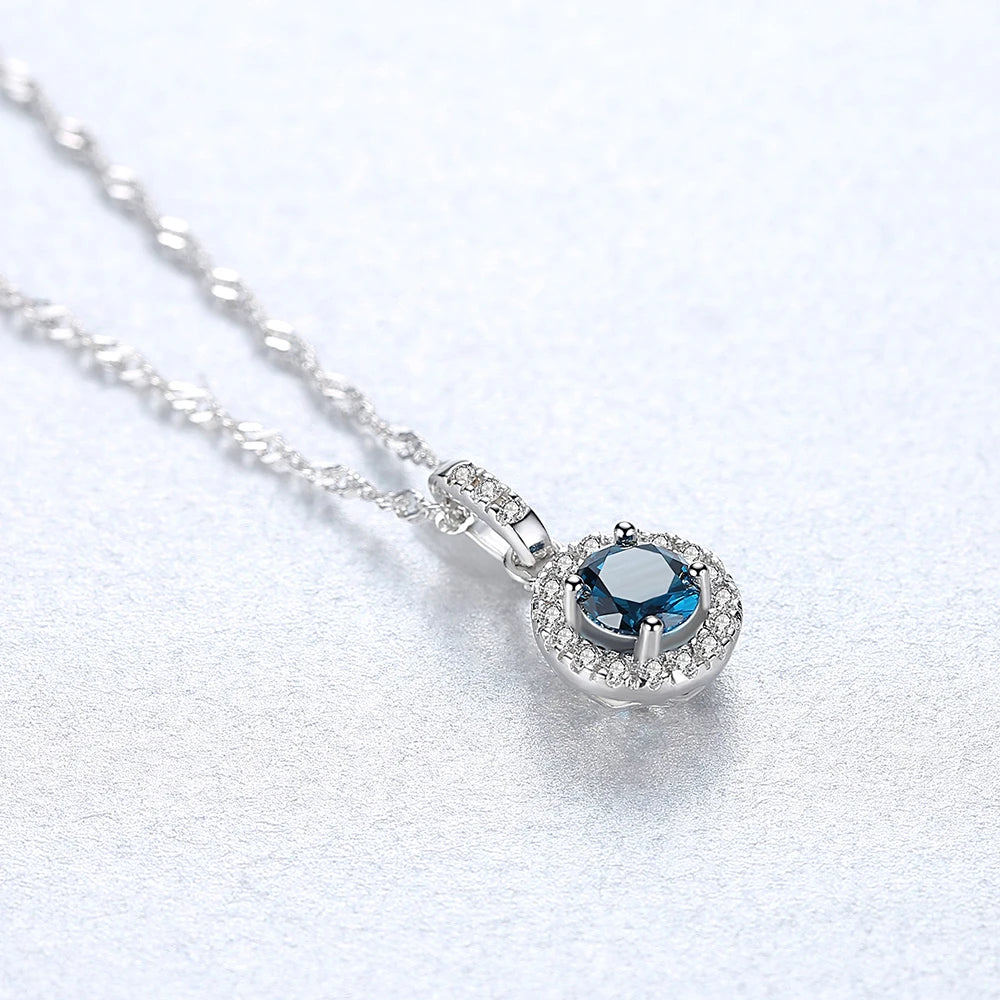 Halo Pendant Necklace in Sterling Silver and Blue Stone