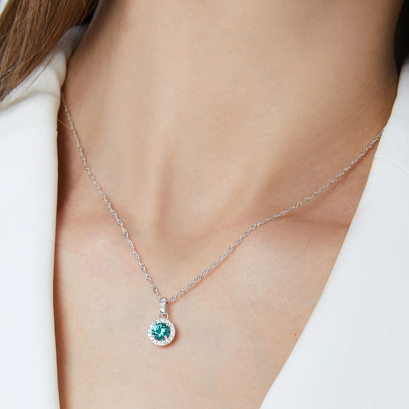 model wearing Sterling Silver Halo Pendant Necklace in Silver and green stone