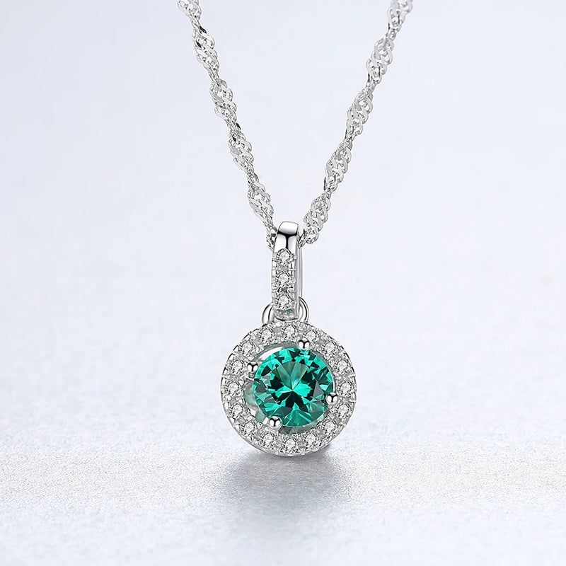 Sterling Silver Halo Pendant Necklace in Silver and green stone