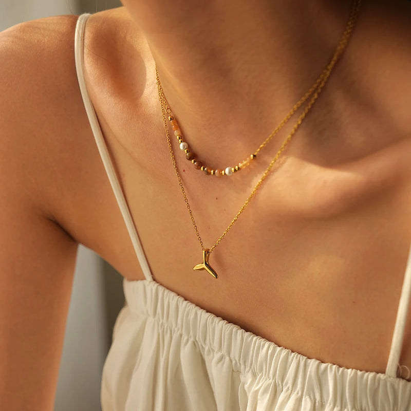 model wearing Waterproof Double Fishtail Necklace in 18K Gold-Plated Stainless Steel