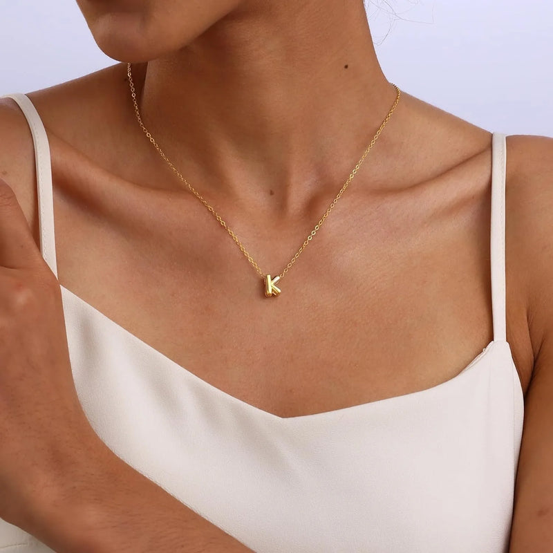 Model wearing 3D Bubble Initial Letter K in 18K Gold-Plated Stainless Steel - Boldly You