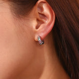 Model wearing LillyFleur Waterproof Colorful Zircon Hoop Earrings in Silver Color