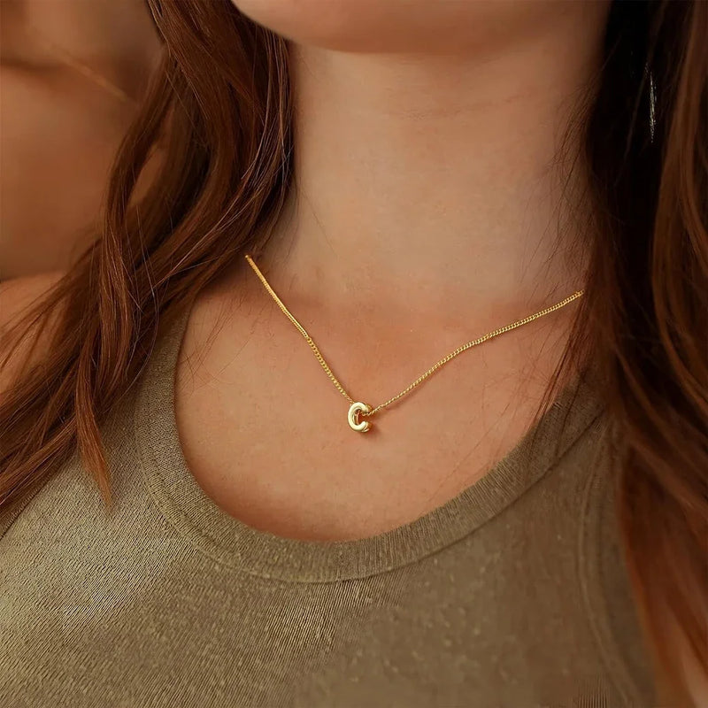 Model wearing 3D Bubble Initial Letter C in 18K Gold-Plated Stainless Steel - Boldly You