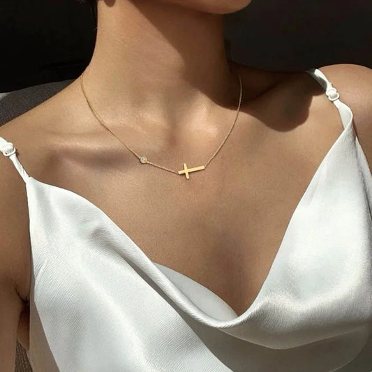 Model wearing Waterproof Gold Cross Necklace and Bracelet set Plated Stainless Steel