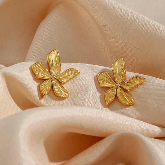 Waterproof Gold Petal Stud Earrings - 18K Gold Plated shown on cetin fabric