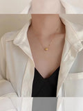 Model wearing Waterproof Heart Bead Chain Necklace and Bracelet Set. 18K gold-plated
