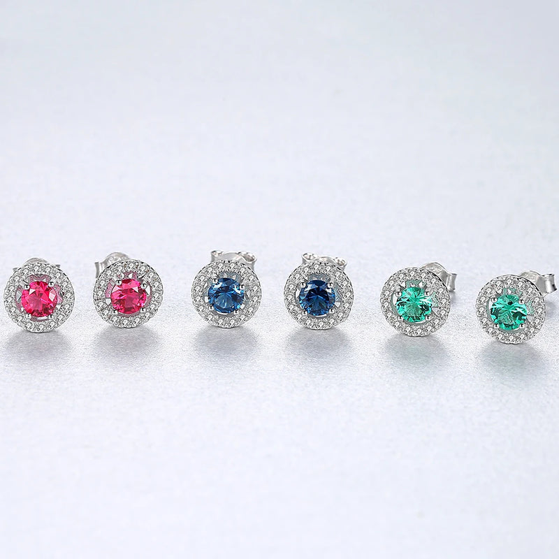 three pairs of sterling silver halo stud earrings in green red andblue 