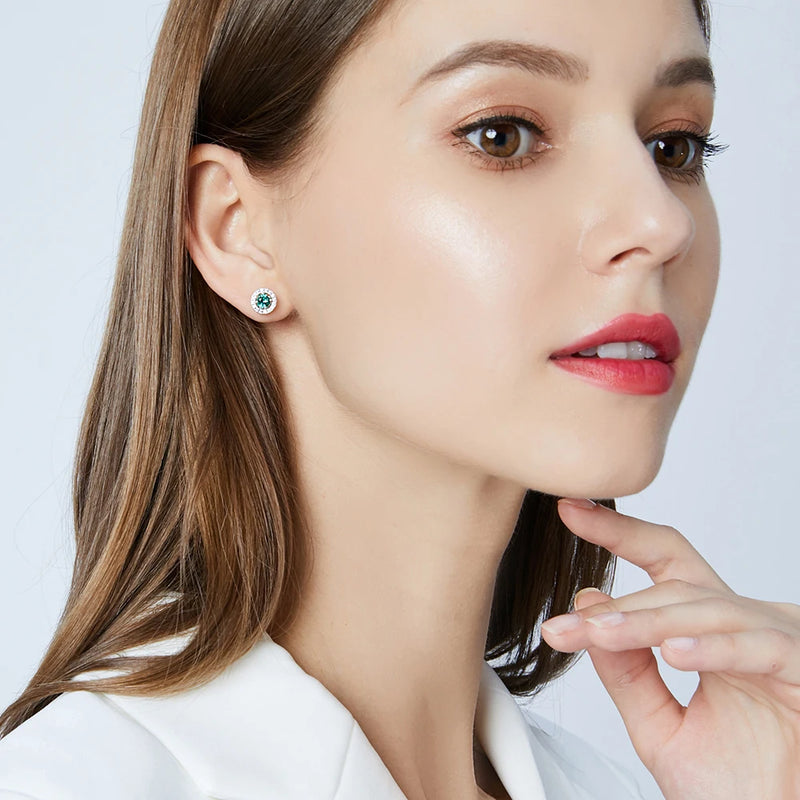 model wearing sterling silver green halo stud earring s