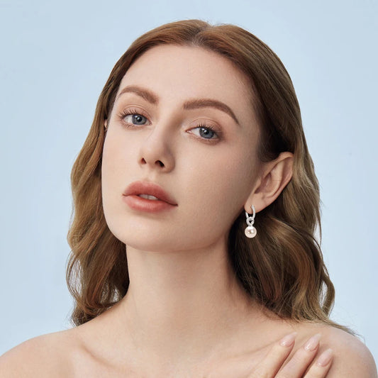 model wearing Pearl & Zircon Hoop Drop Earrings in 14K White Gold Plated Sterling Silver