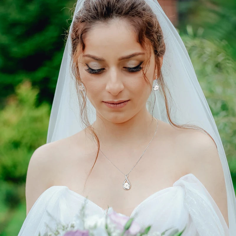 bride wearing Freshwater Pearl & Moissanite Set in Silver