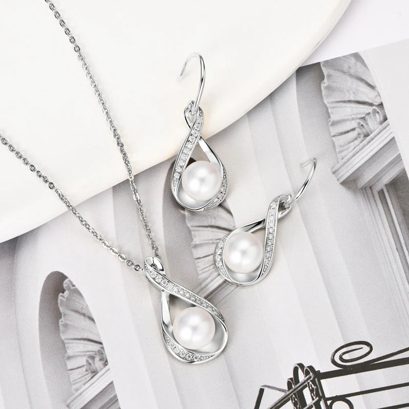 Freshwater Pearl & Moissanite Set in Silver on magazine background