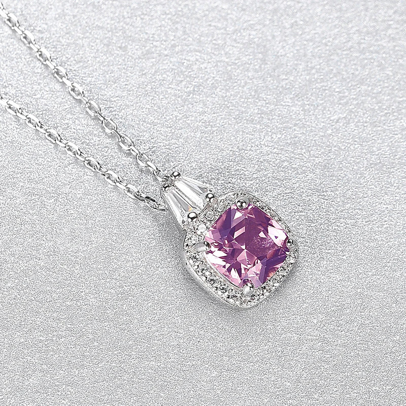 Pink Crystal Pendant Necklace in Silver display on a silver surface