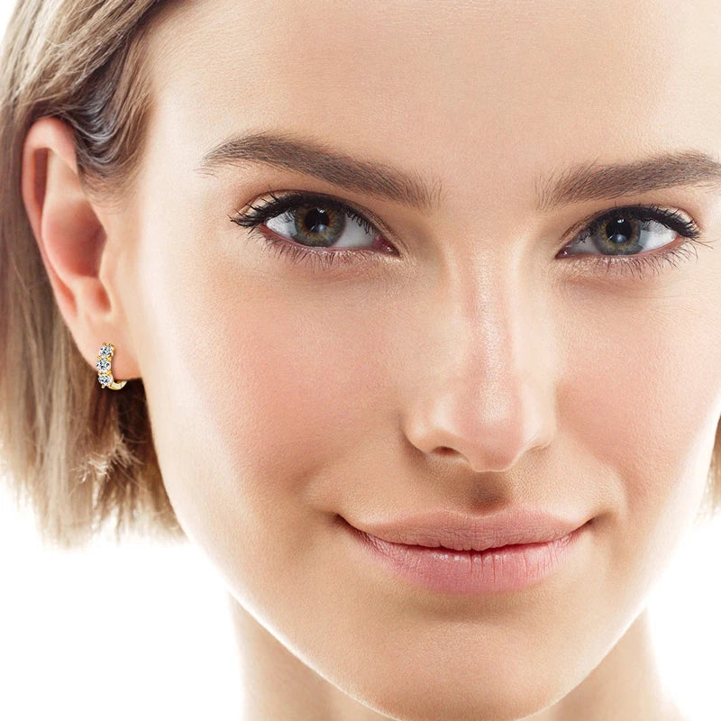 model wearing round-moissanite-diamond-hoop-earrings Yellow Gold Plated Silver 