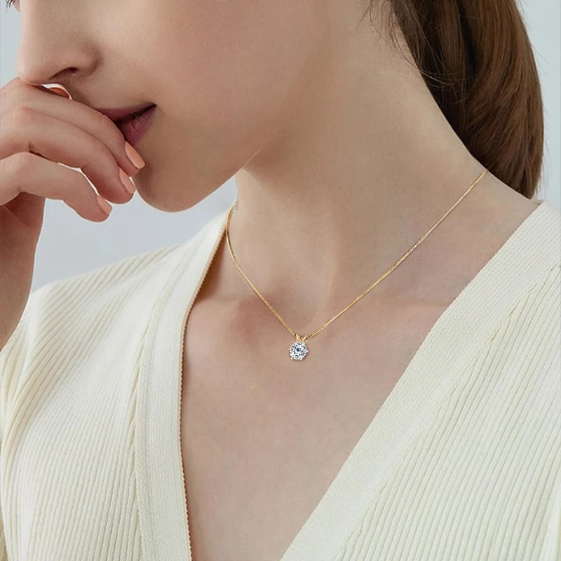 model wearing solitaire moissanite  necklace in yellow gold plated silver