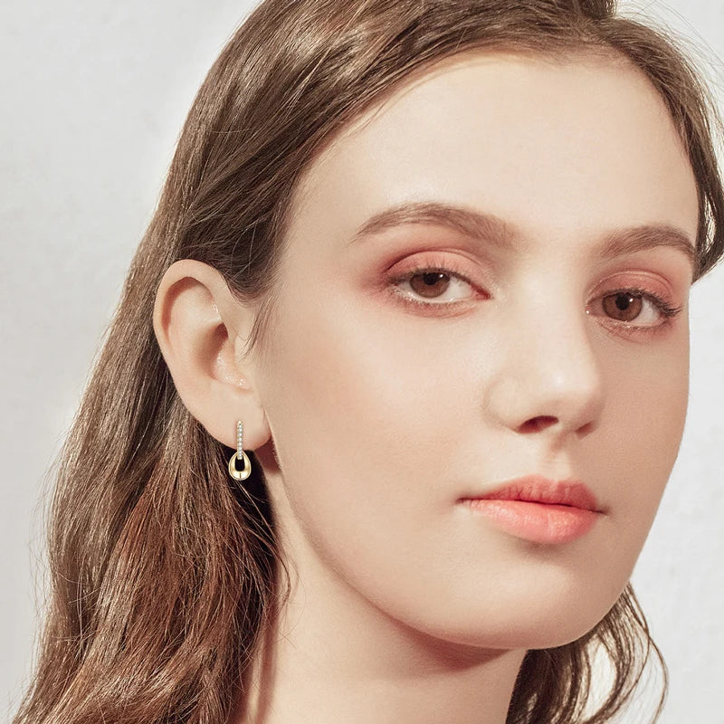 model wearing Moissanite Hoops Earrings in Yellow Gold Plated Silver 