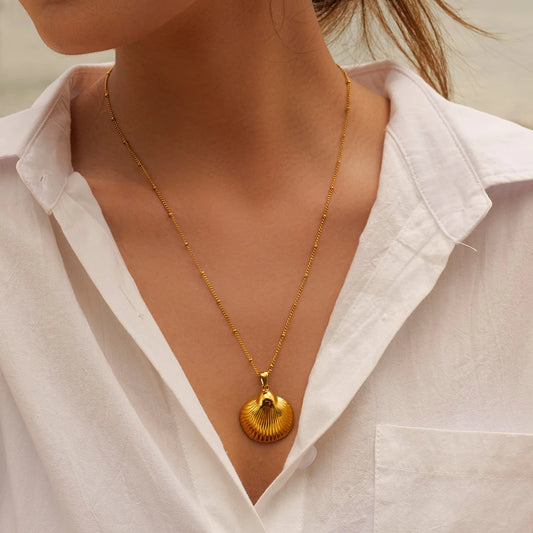 Model wearing waterproof gold Gold Shell Necklace in 18K Gold-Plated  Stainless Steel
